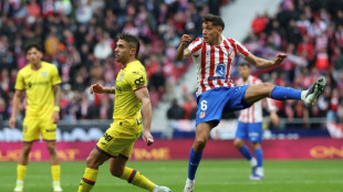 Molina rocket helps Atletico beat 10-man Getafe