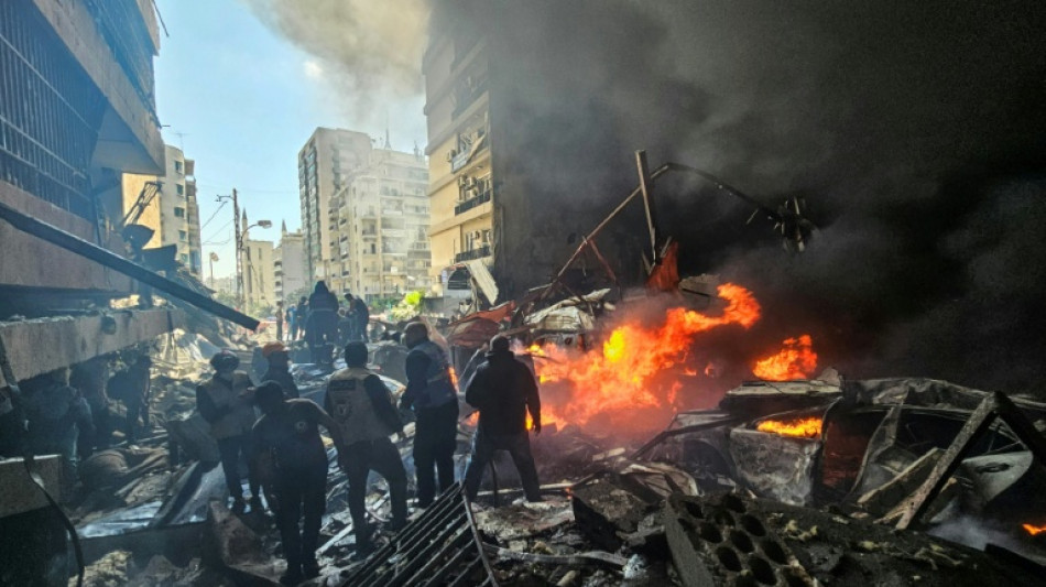 In the heart of Beirut, buildings in flames and charred cars