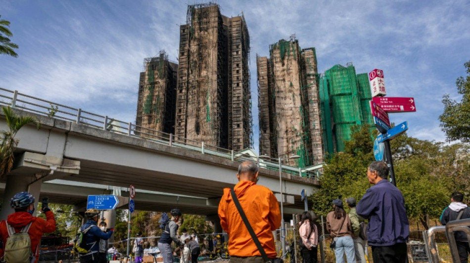 'Tormenting': Relatives search through images of the dead after Hong Kong blaze